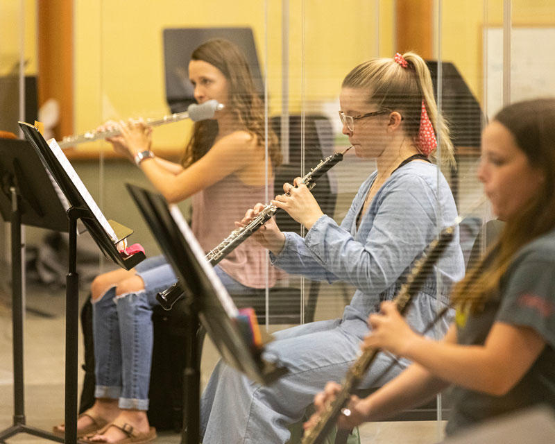 Students rehearse using flute, oboe, and english horn.